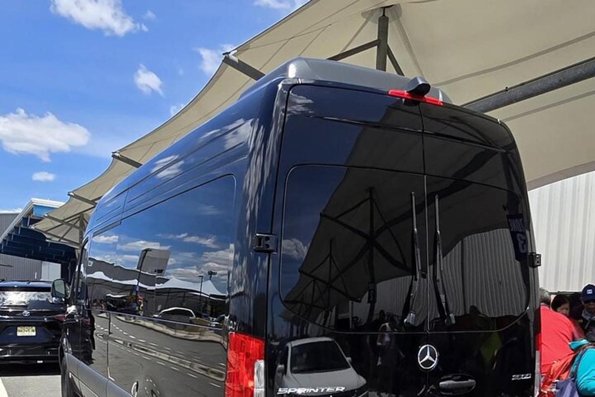 a large bus is parked under a tent