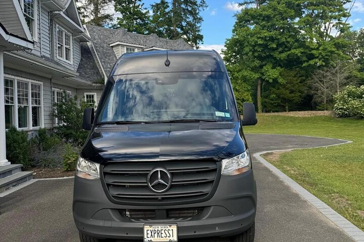 a mercedes van parked in front of a house