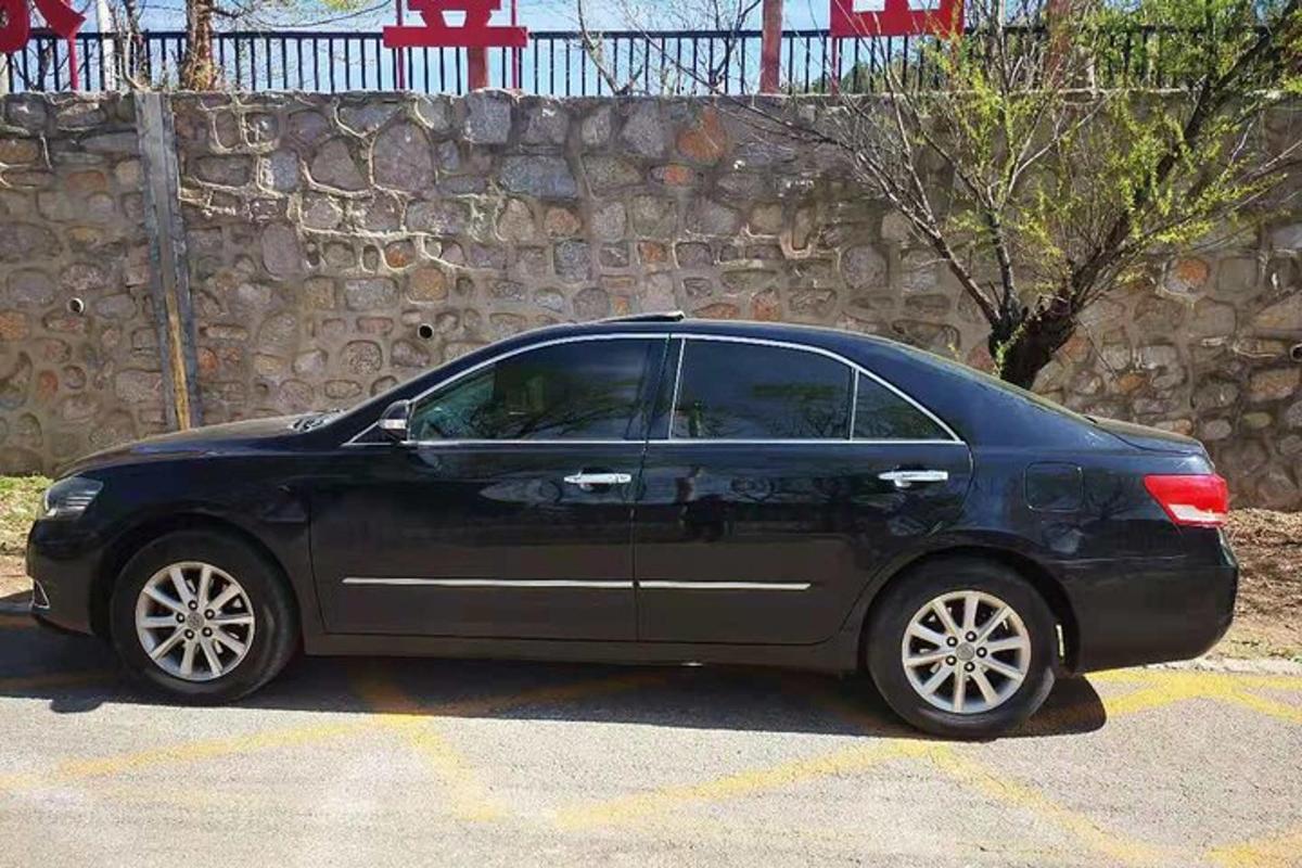 a black car parked in a parking lot