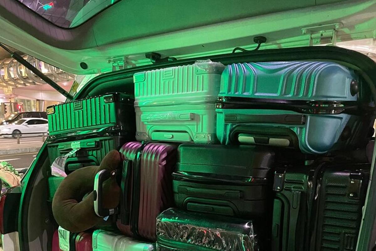 a group of suitcases in the back of a vehicle