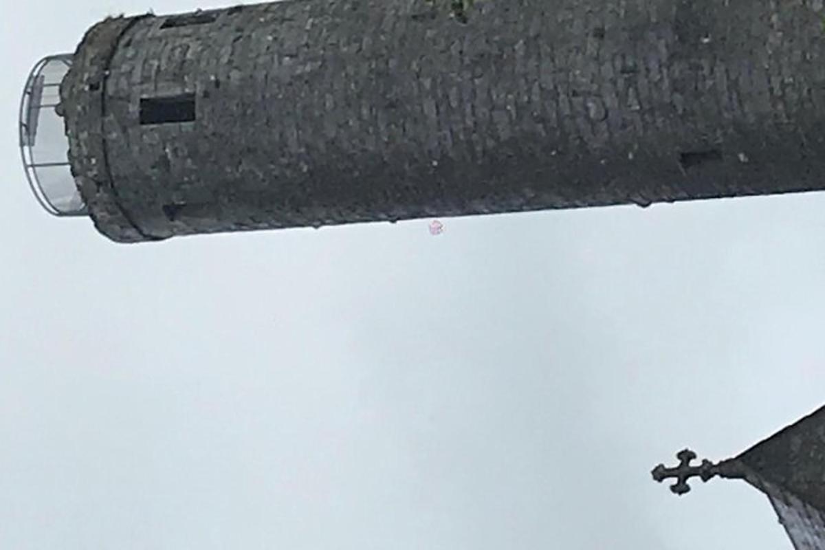 a close up of a street light on a pole