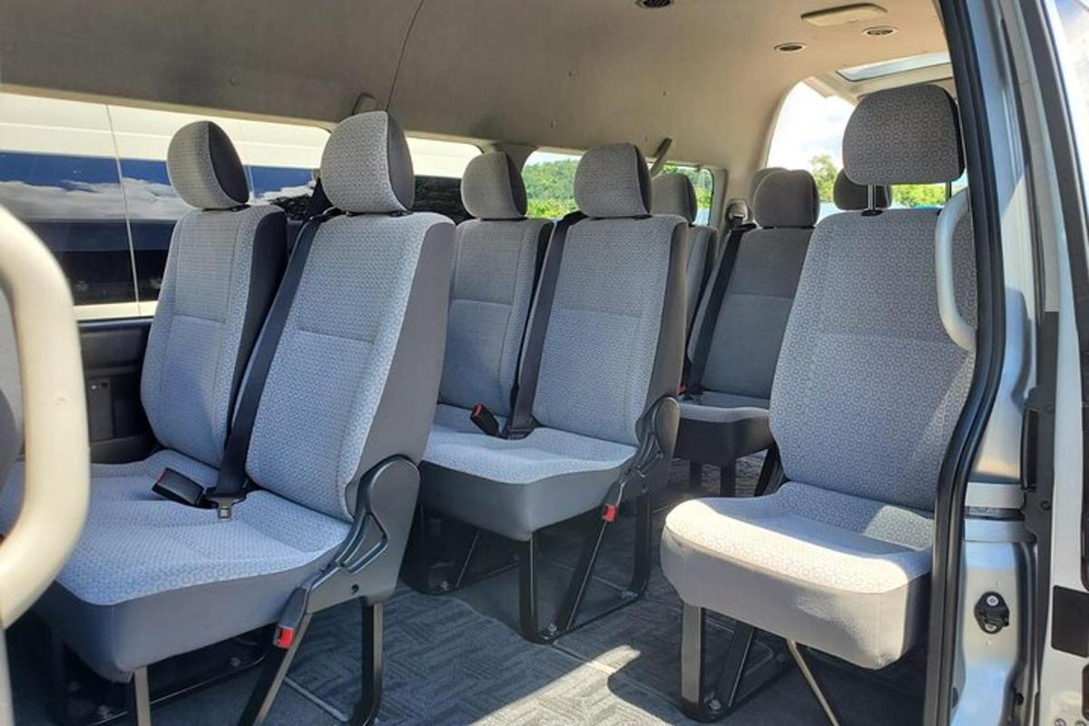 an inside view of a van with blue seats
