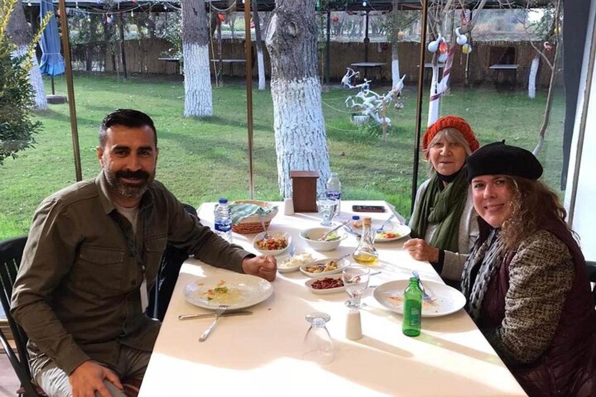 a group of people sitting at a table eating food