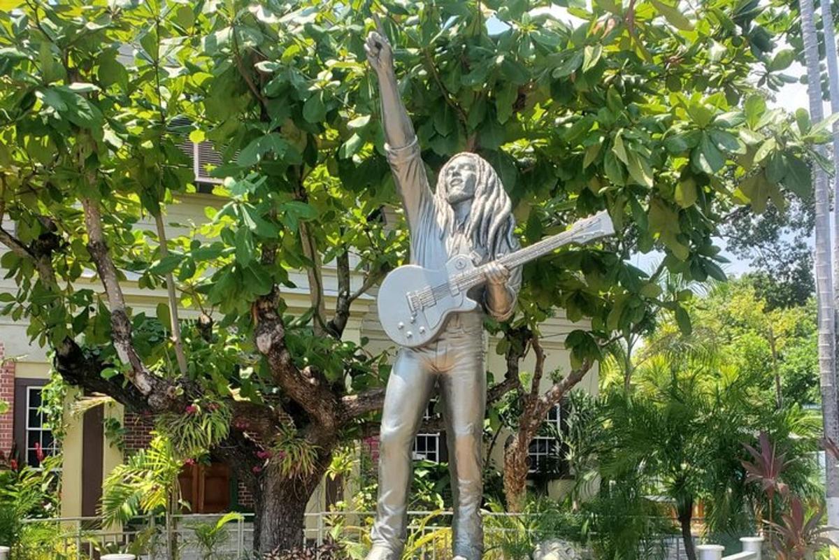 a statue of a man holding a guitar