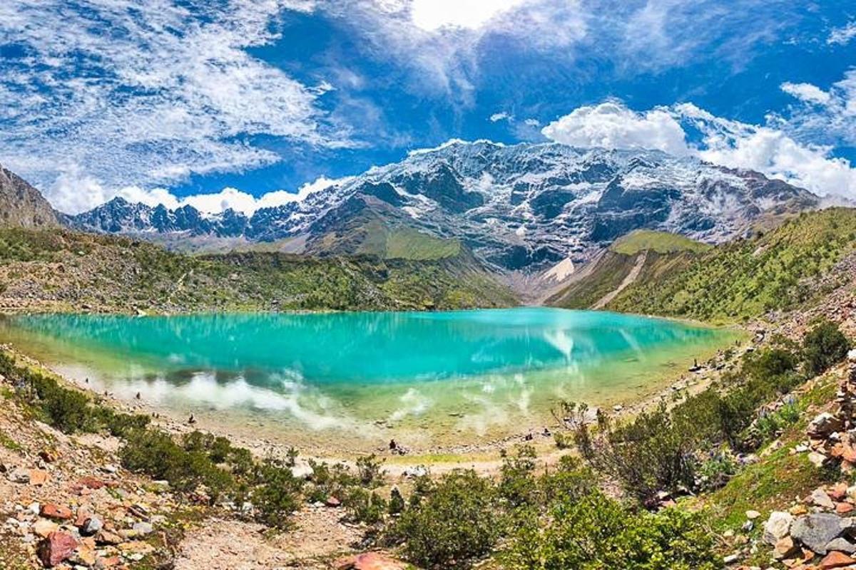 a view of a blue lake in the mountains