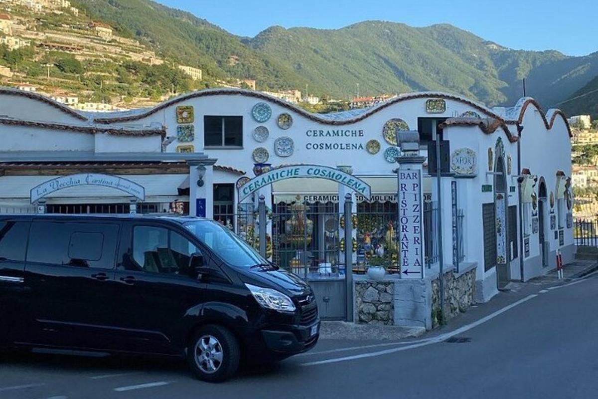 a black van parked in front of a building