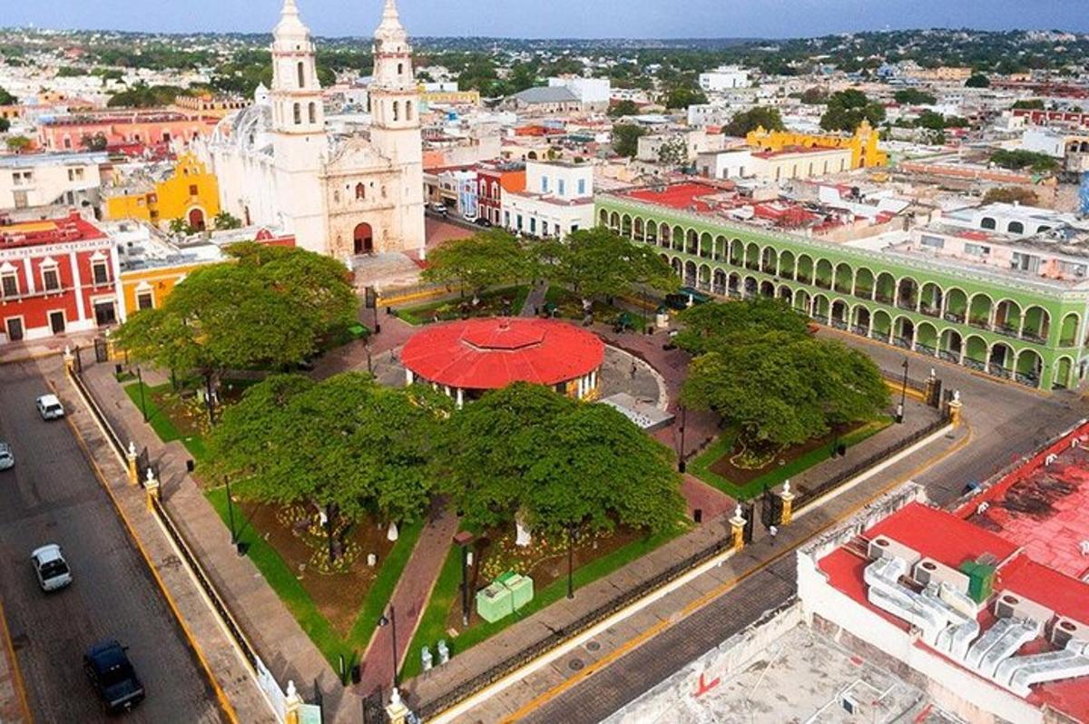 an aerial view of a city with a church