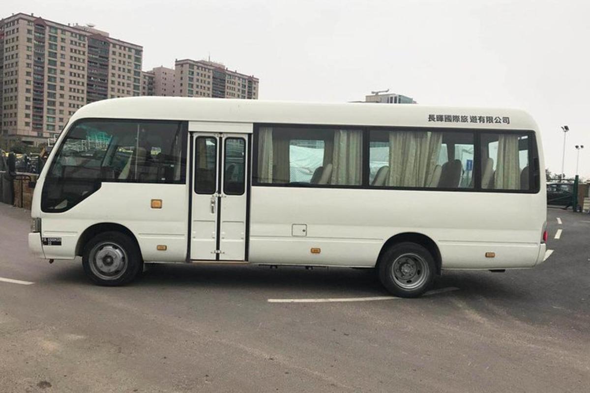 a white bus parked in a parking lot