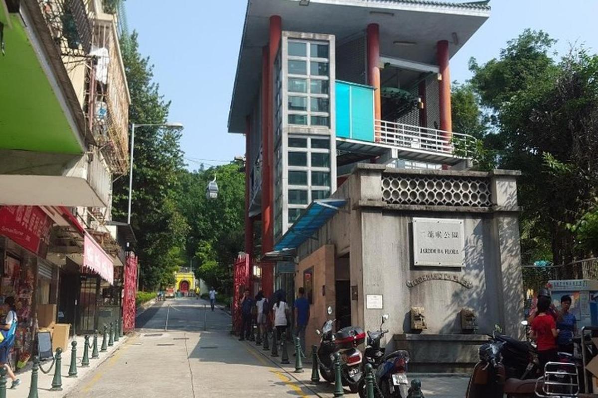 a group of people standing on a street next to a building