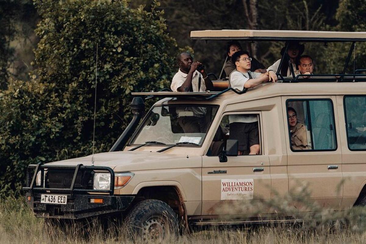 a group of people riding in the back of a vehicle