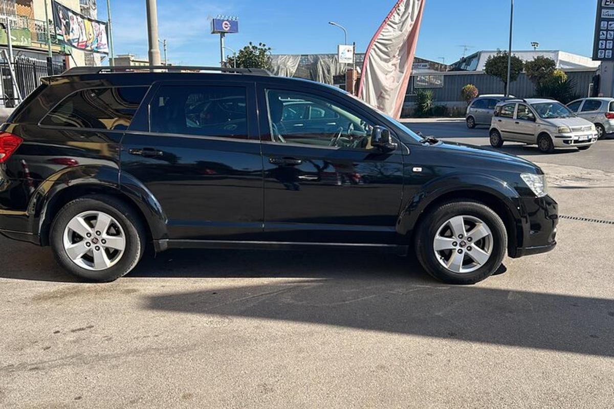 a black car parked in a parking lot