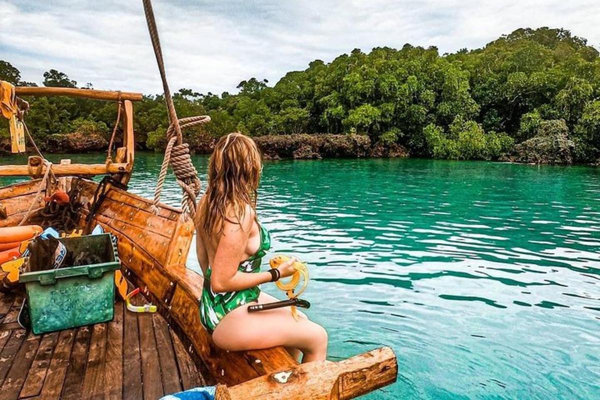 a woman sitting on a boat in the water