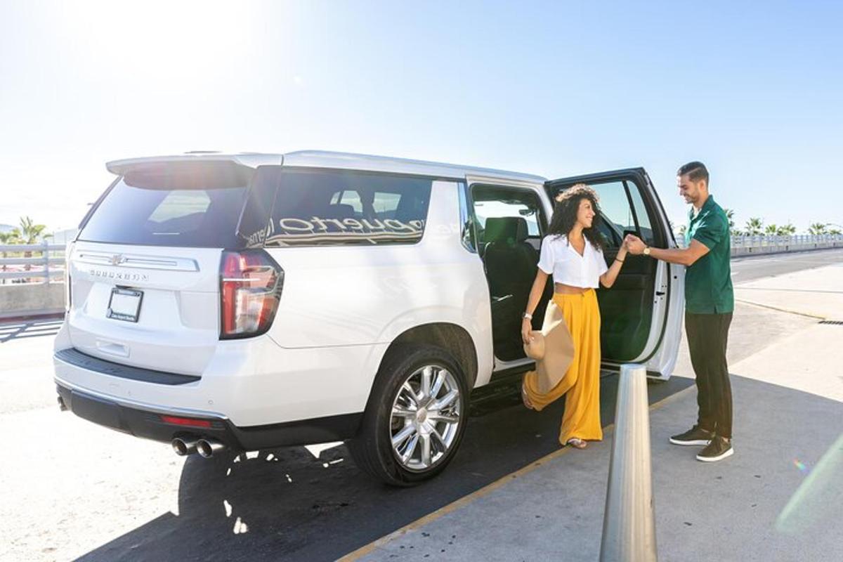 a man and woman getting into a white van
