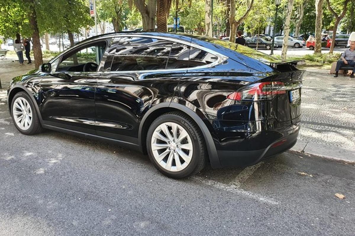 a black car parked in a parking lot