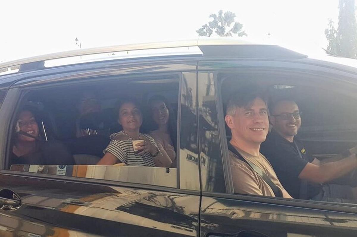 a group of people sitting in the back of a car