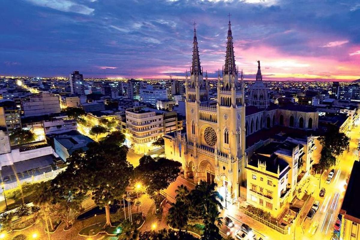 a large cathedral building with a city at night