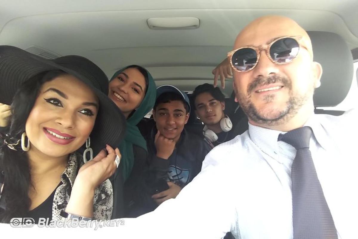 a group of people in the back of a car