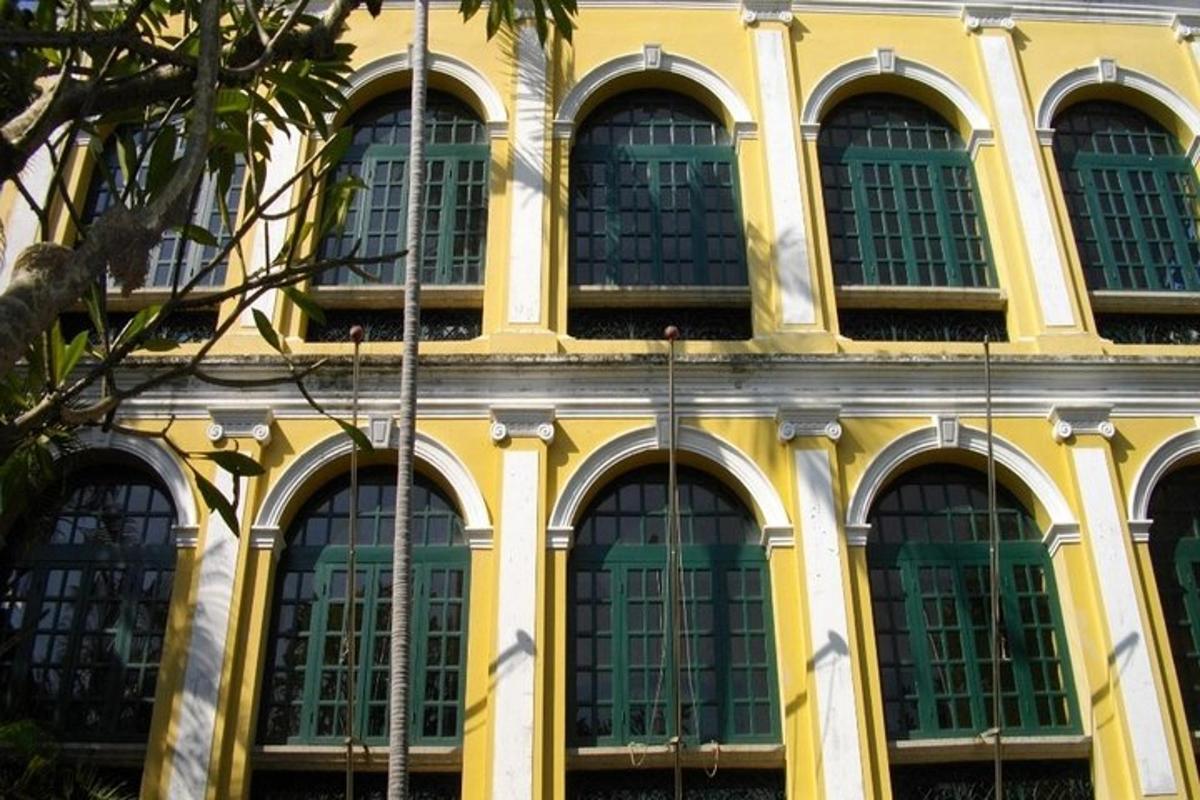 a yellow building with many windows