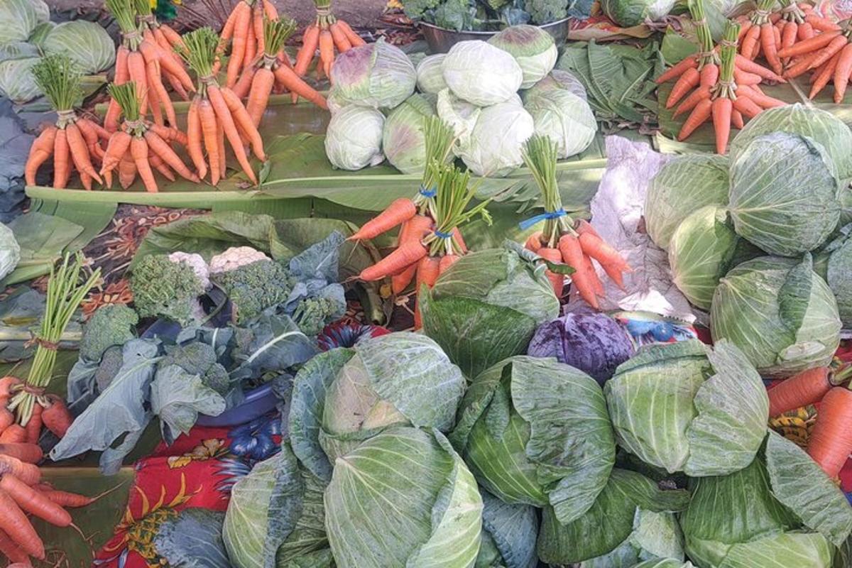 a pile of vegetables on display at a market