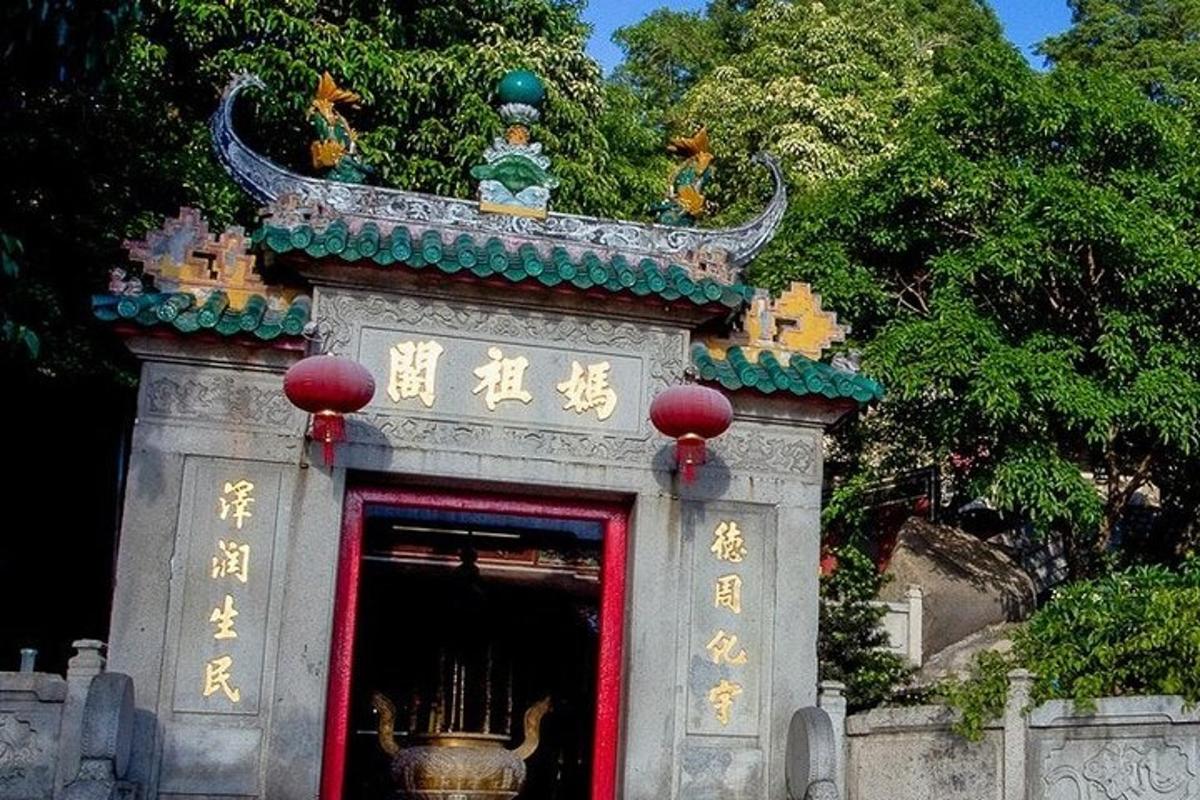 a gate to a temple with chinese writing on it