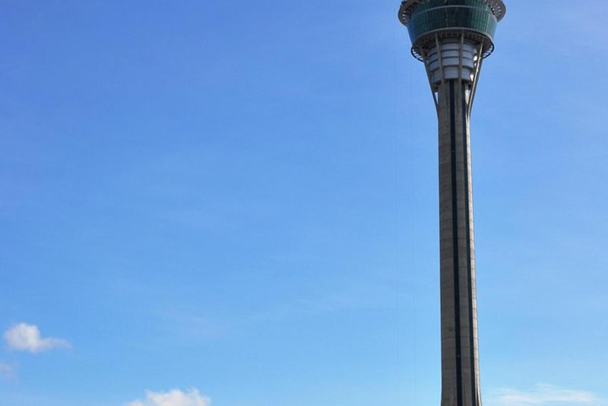 a tall tower with a blue sky in the background