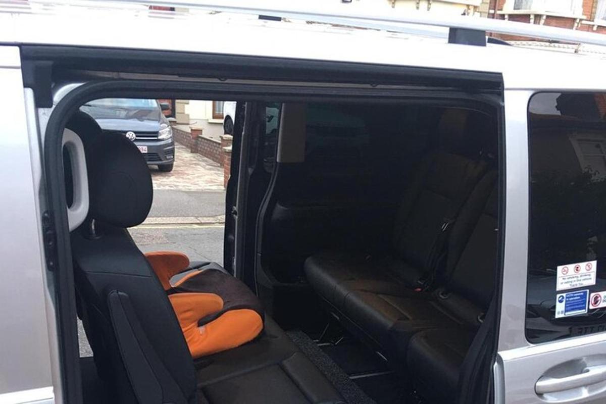 a back seat of a van with the door open