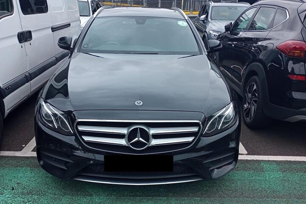 a mercedes benz car parked in a parking lot