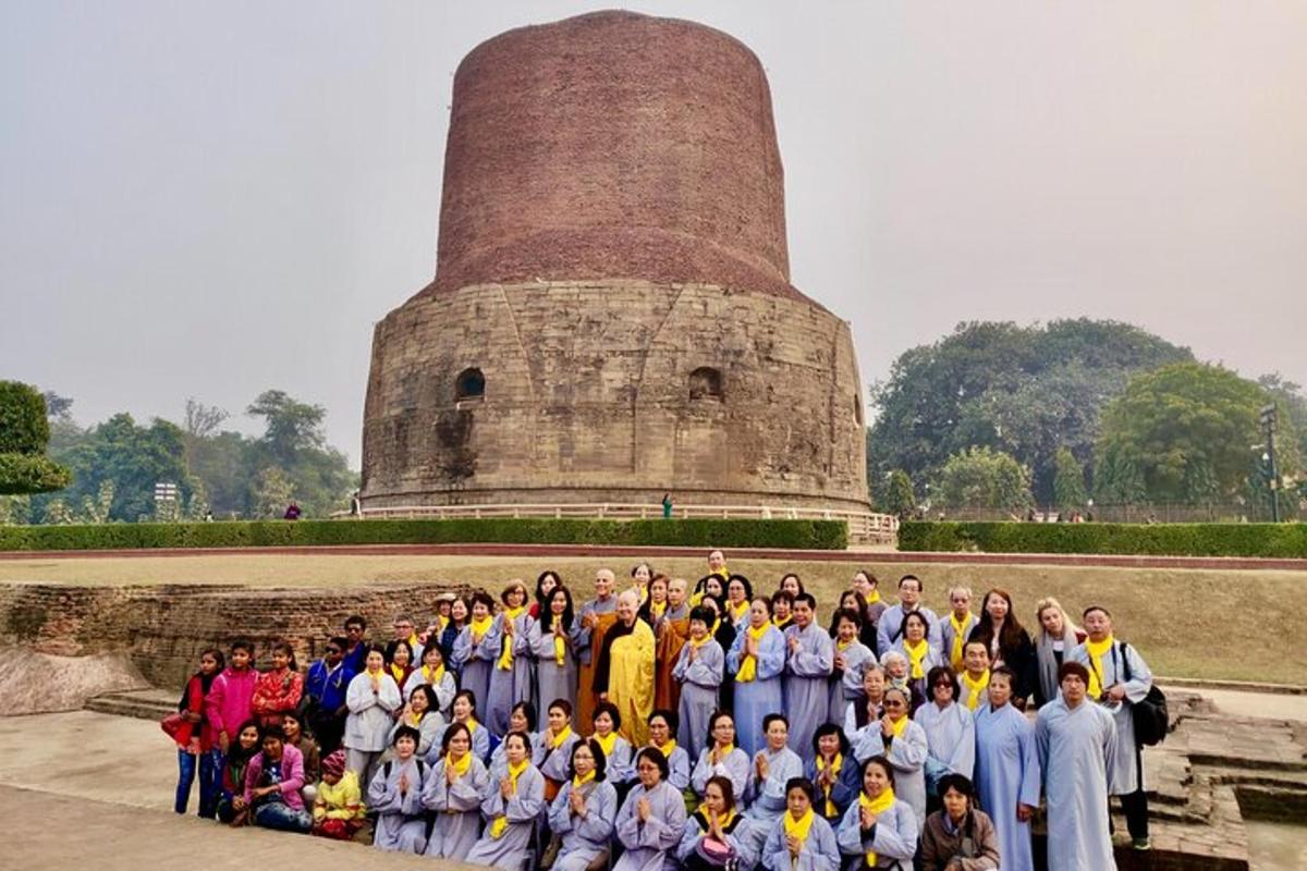a group of people posing in front of a tower