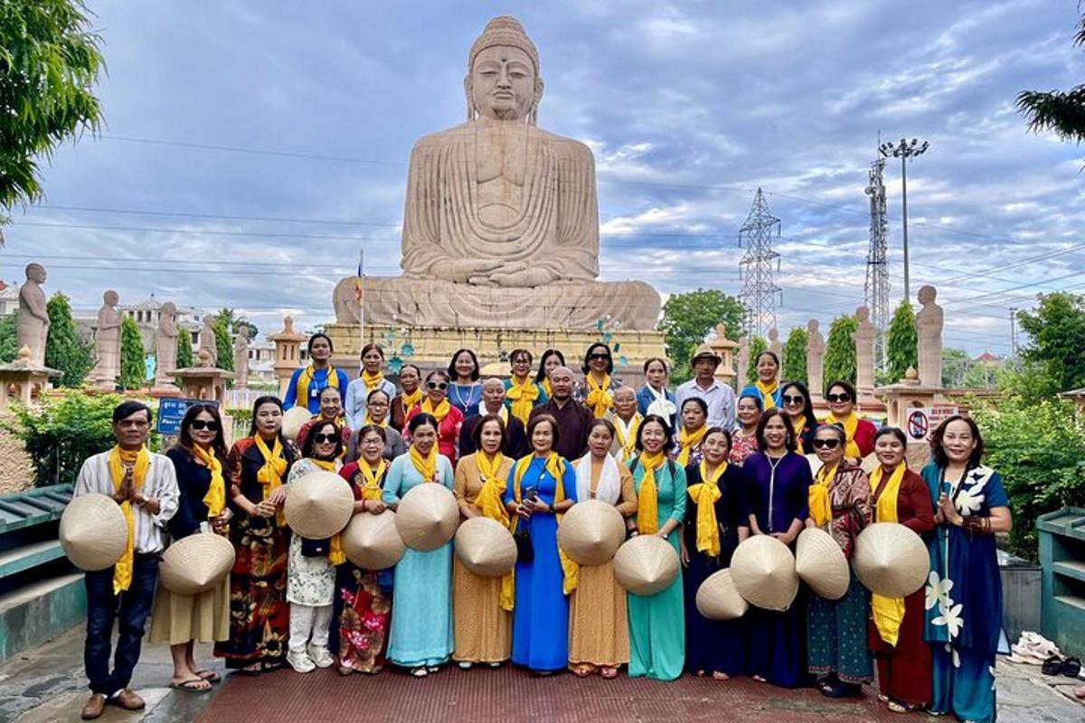 a group of people standing in front of a statue