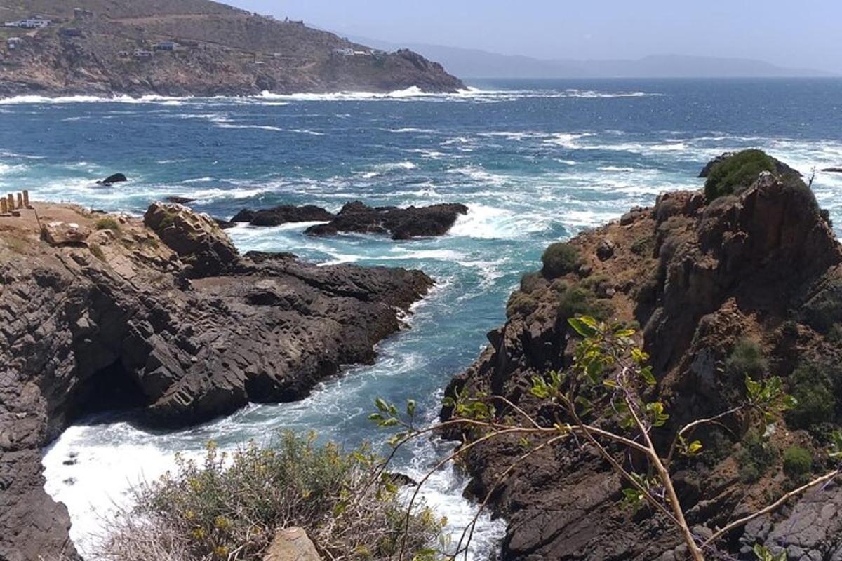 a view of the ocean from a rocky coastline