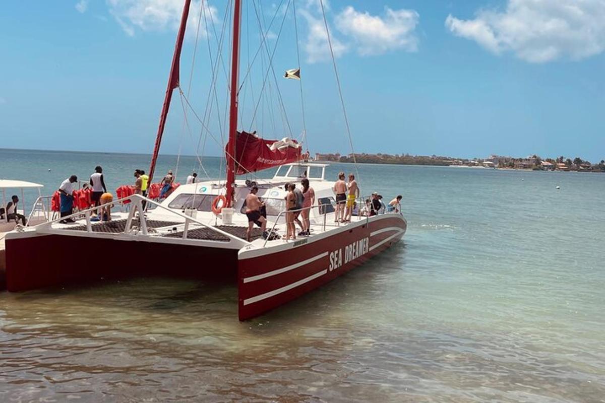 a group of people standing on a boat in the water