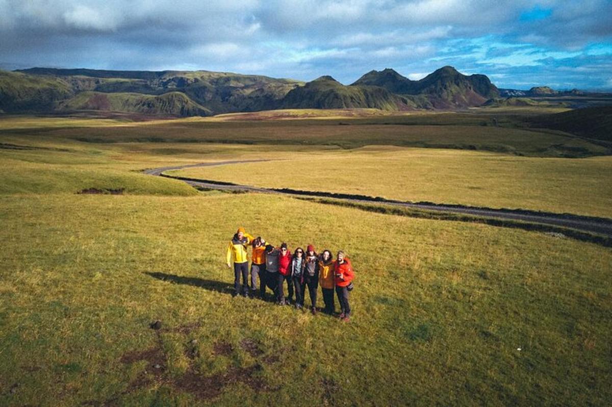 a group of people standing in a field