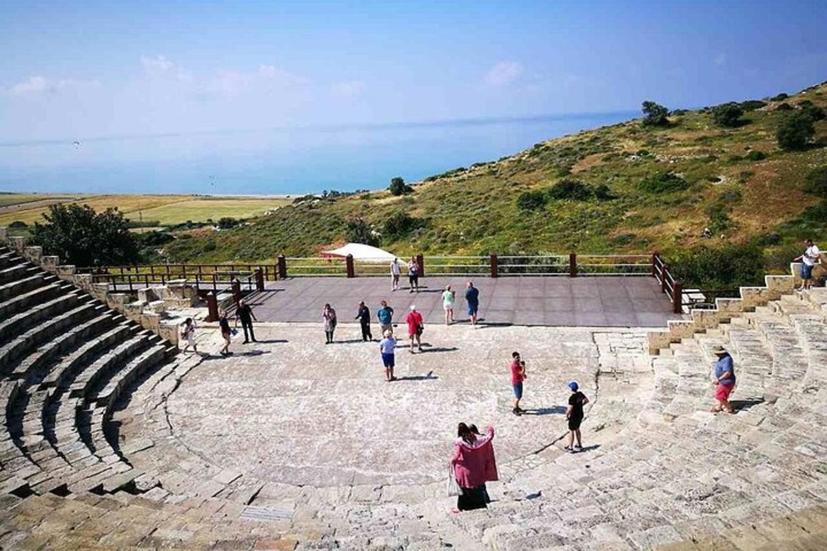 a group of people walking around an amphitheater