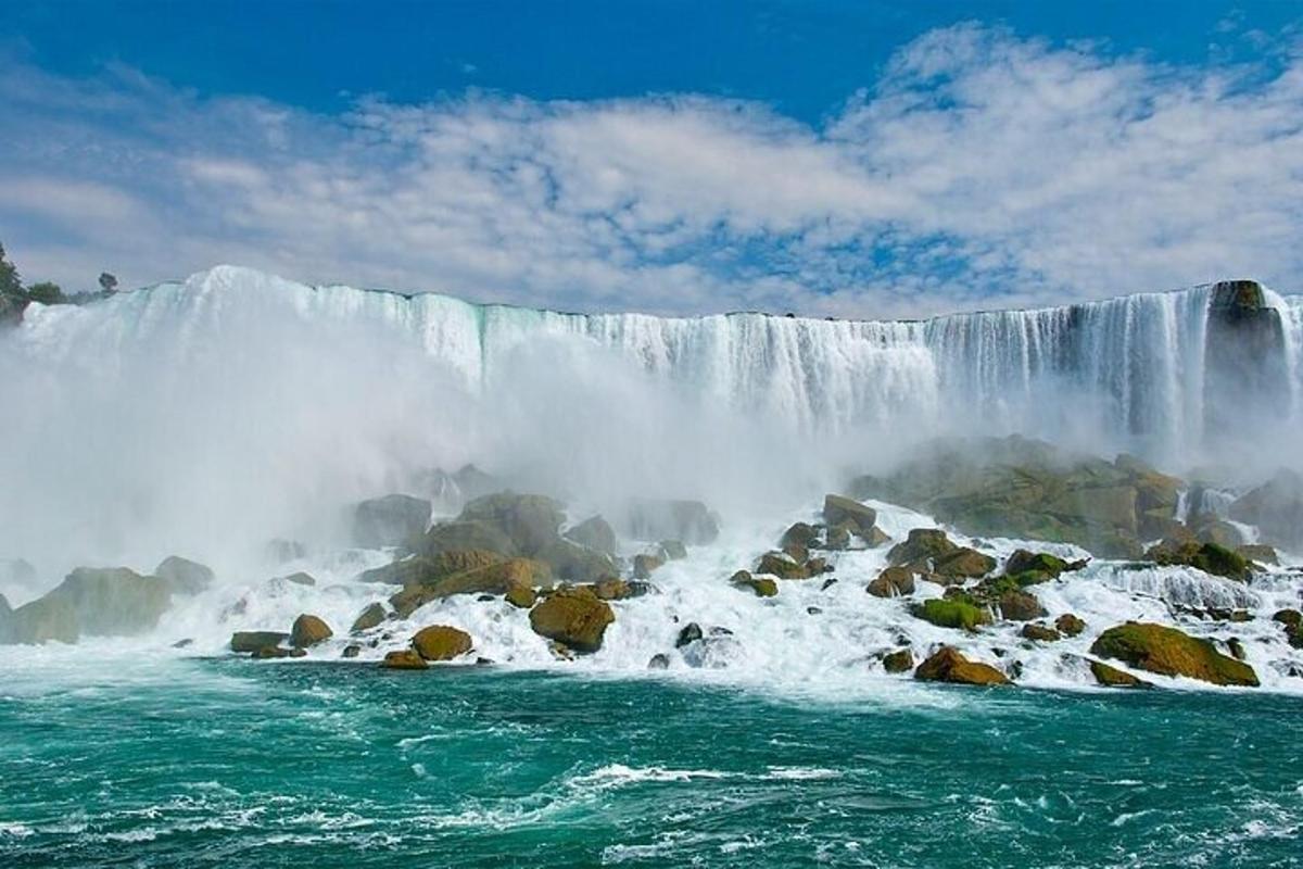 a large waterfall with water pouring over rocks