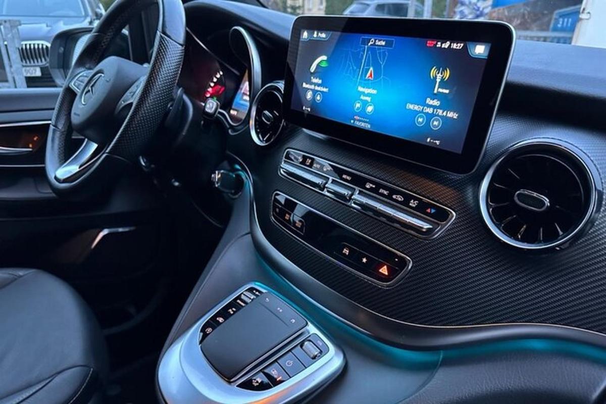 a tablet sitting on the dashboard of a car
