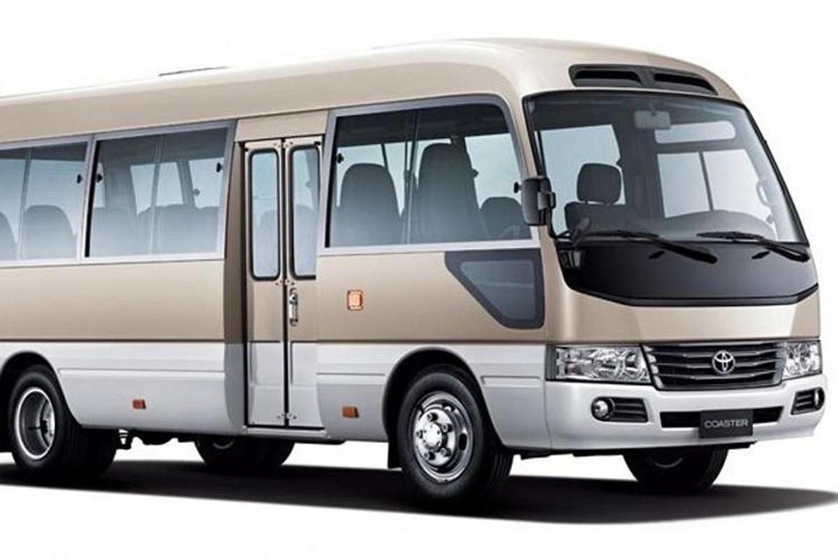 a silver bus is parked on a white background