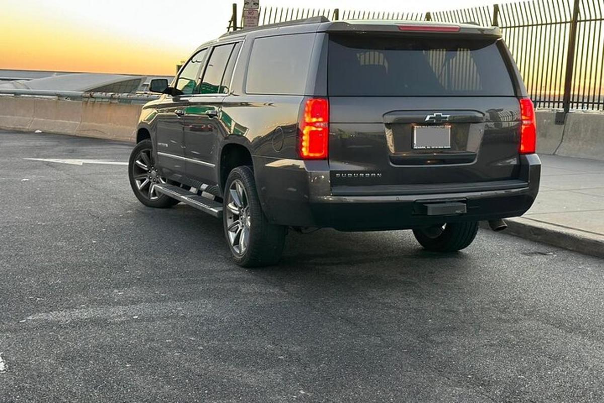 a black suv parked in a parking lot