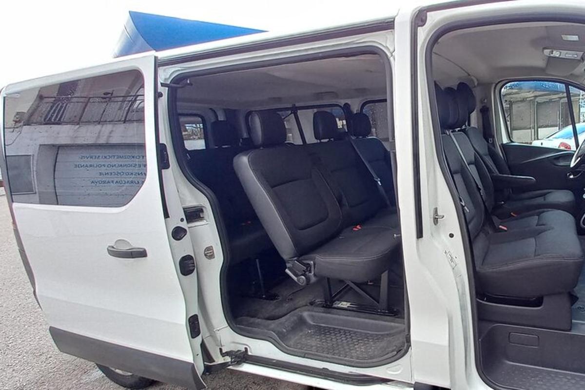 an open door of a white van with the door open