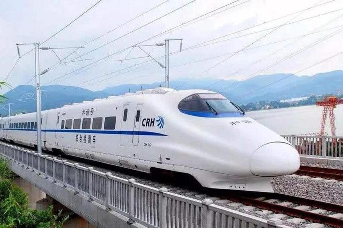 a white train is on the tracks