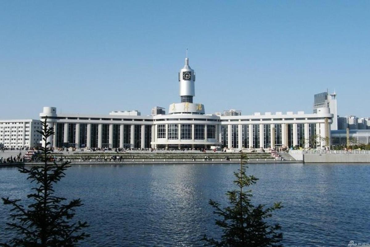 a large building next to a large body of water