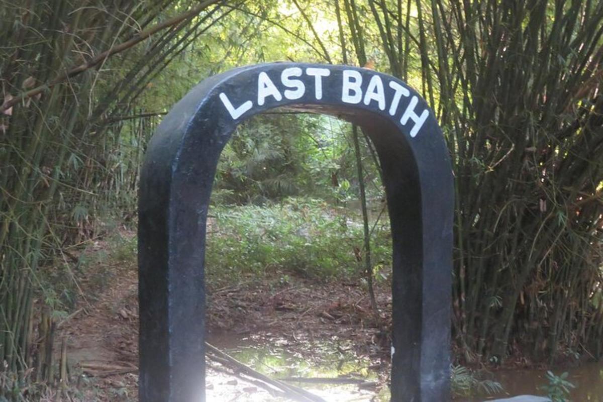 a sign that says last bank in a garden