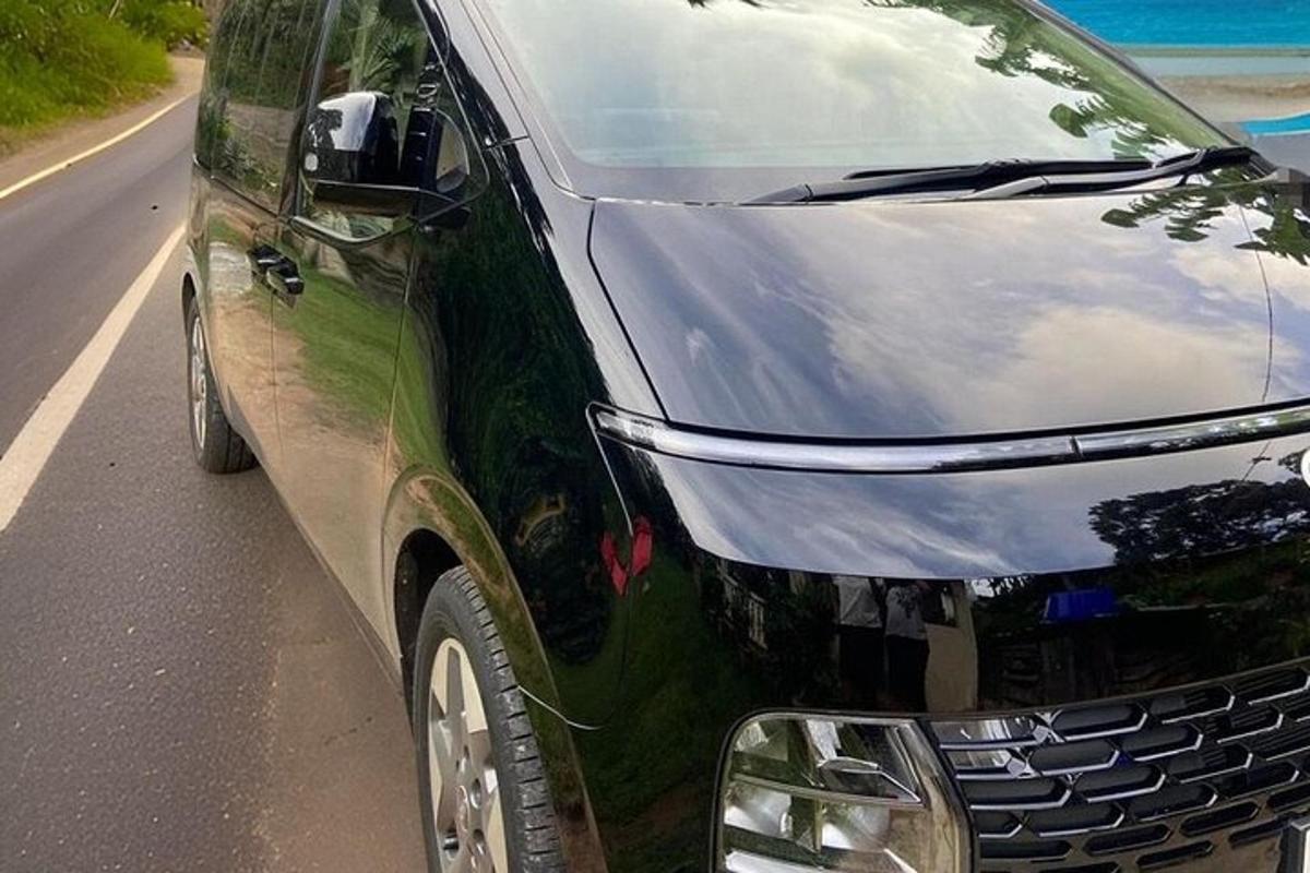 a black van parked on the side of a road