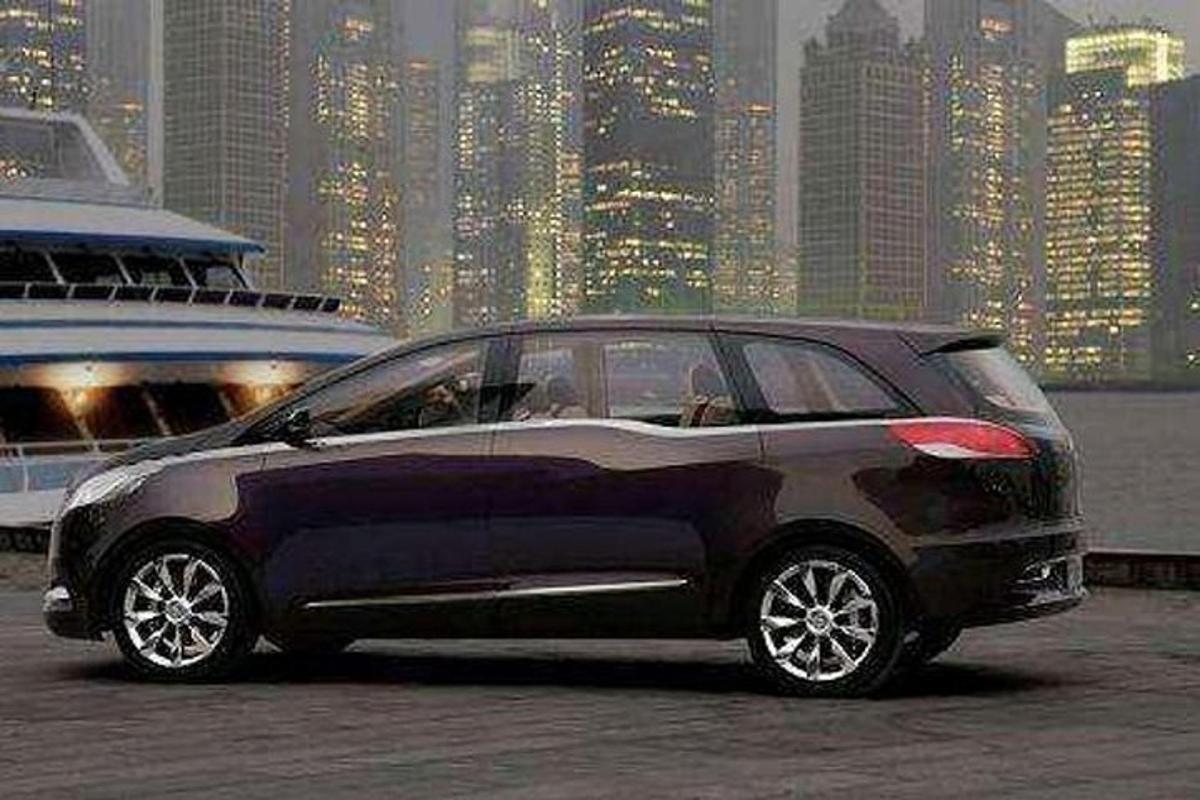 a black car parked in front of a large city