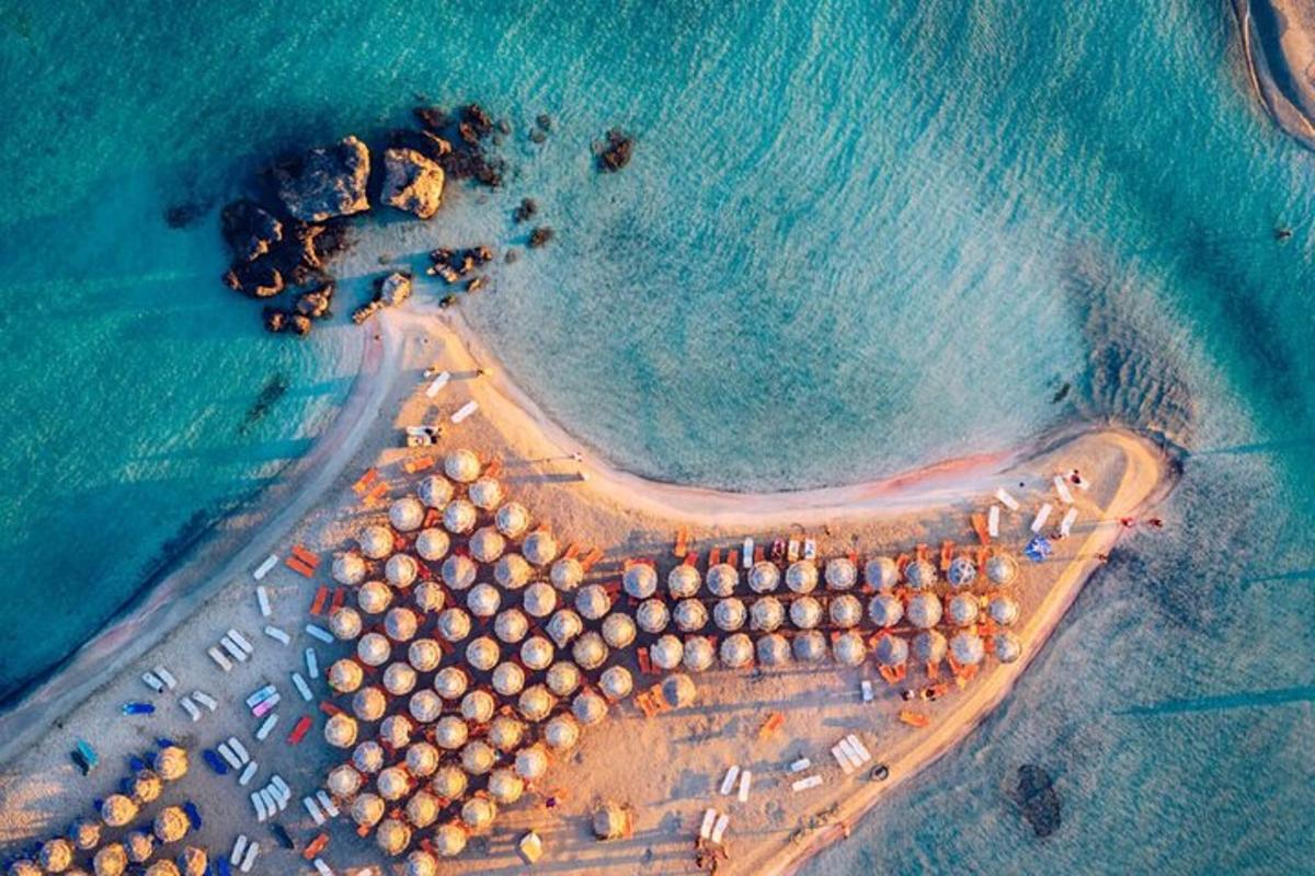 an aerial view of a beach with a group of buildings