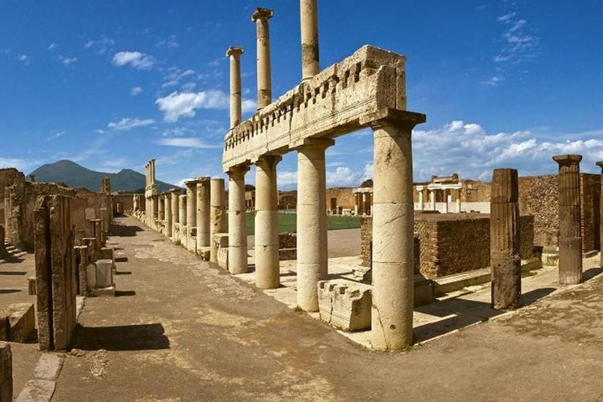 a row of columns in the ruins of a building