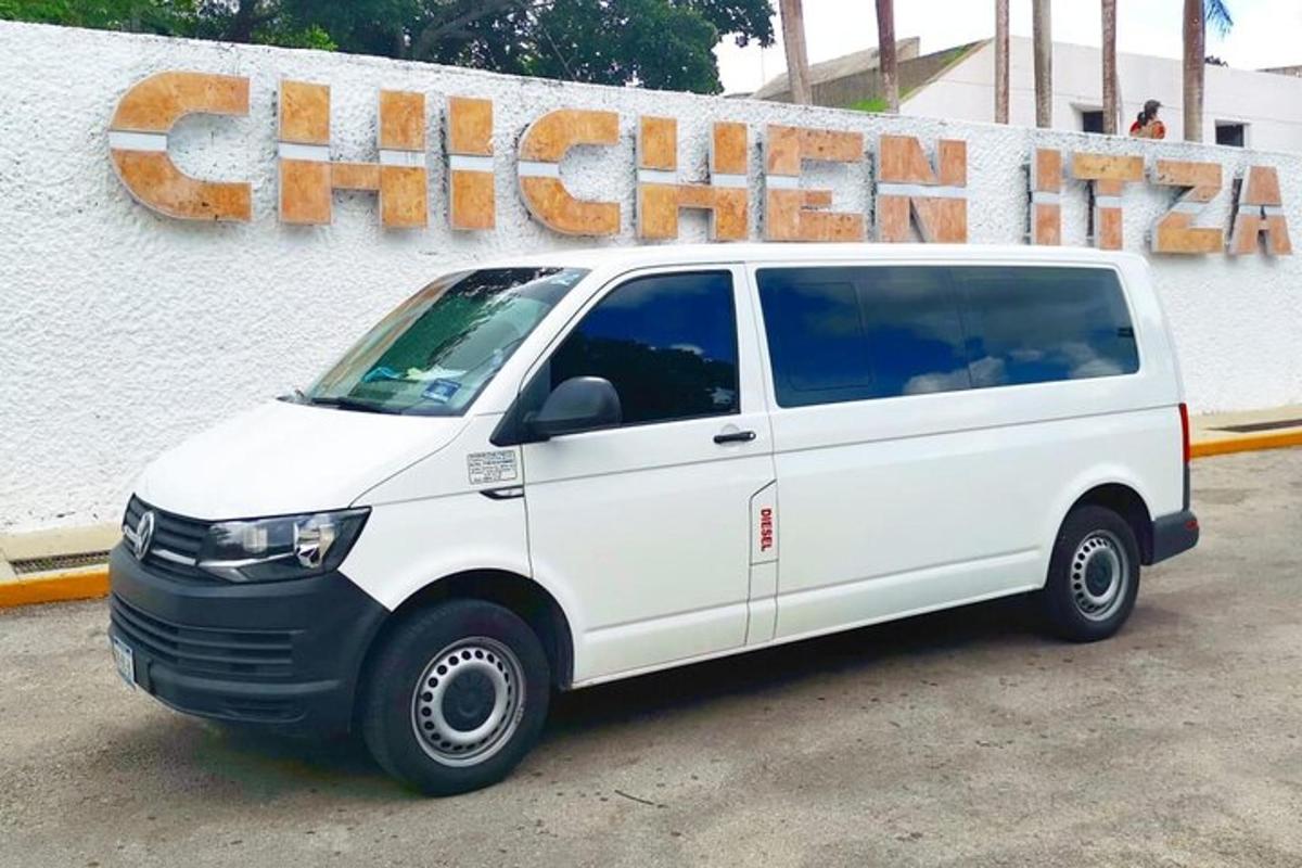 a white van parked in front of a building