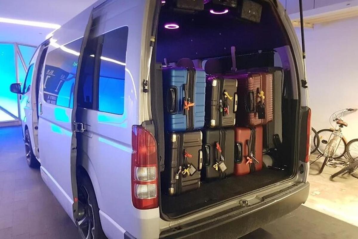 a van with its trunk full of different types of tools
