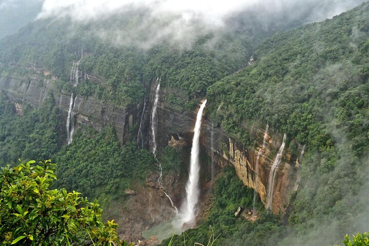 a waterfall on the side of a mountain