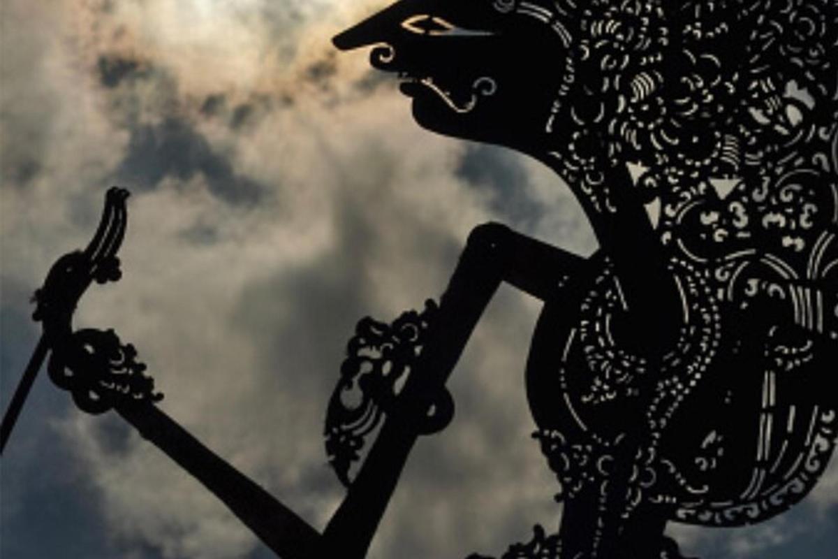 a metal statue of a horse on a pole