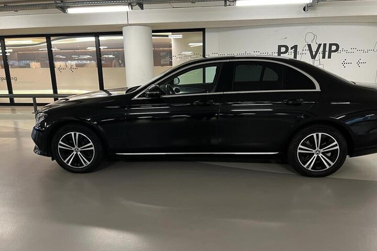 a black car is parked in a building